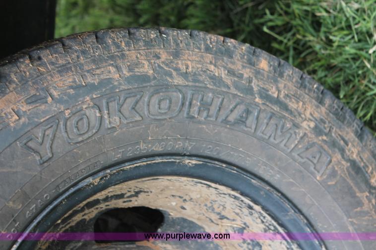 image for item K8913 2014 Dodge Ram 3500HD Quad Cab flatbed pickup truck