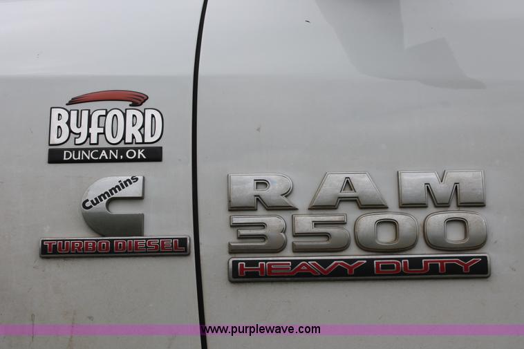 image for item K8913 2014 Dodge Ram 3500HD Quad Cab flatbed pickup truck