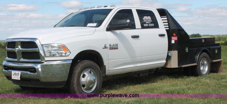 image for item K8914 2014 Dodge Ram 3500HD Quad Cab flatbed pickup truck
