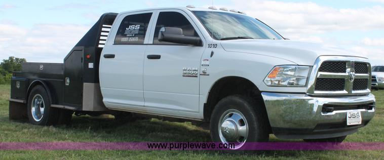 image for item K8914 2014 Dodge Ram 3500HD Quad Cab flatbed pickup truck