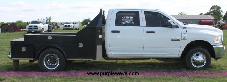 image for item K8914 2014 Dodge Ram 3500HD Quad Cab flatbed pickup truck