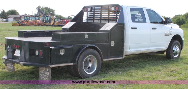 image for item K8914 2014 Dodge Ram 3500HD Quad Cab flatbed pickup truck