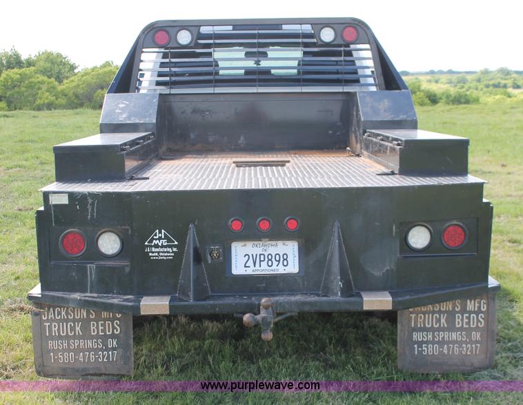 image for item K8914 2014 Dodge Ram 3500HD Quad Cab flatbed pickup truck