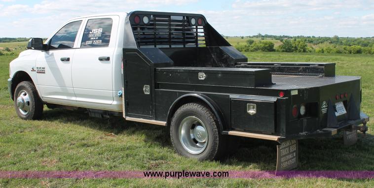 image for item K8914 2014 Dodge Ram 3500HD Quad Cab flatbed pickup truck