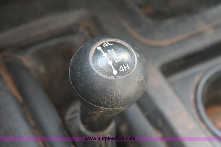 image for item K8914 2014 Dodge Ram 3500HD Quad Cab flatbed pickup truck