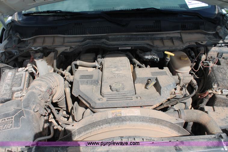 image for item K8914 2014 Dodge Ram 3500HD Quad Cab flatbed pickup truck