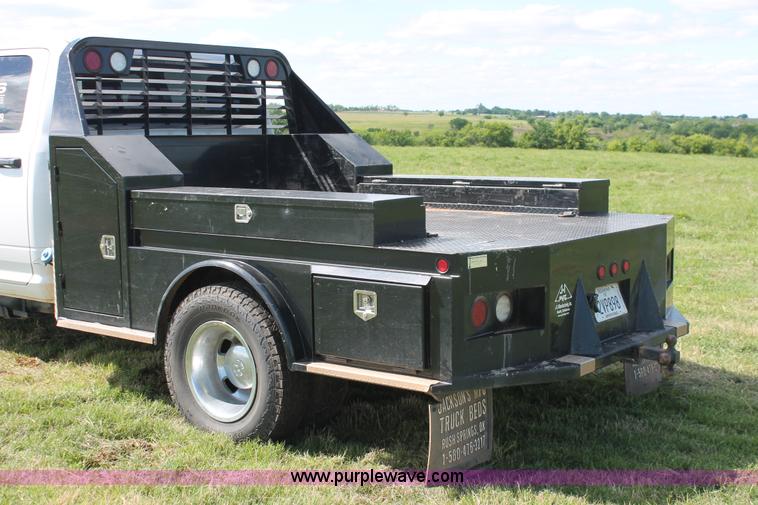 image for item K8914 2014 Dodge Ram 3500HD Quad Cab flatbed pickup truck