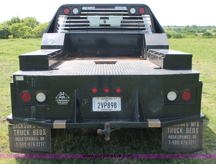 image for item K8914 2014 Dodge Ram 3500HD Quad Cab flatbed pickup truck