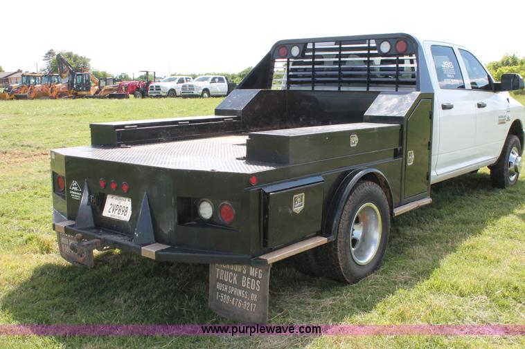 image for item K8914 2014 Dodge Ram 3500HD Quad Cab flatbed pickup truck