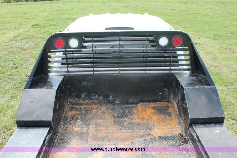 image for item K8914 2014 Dodge Ram 3500HD Quad Cab flatbed pickup truck