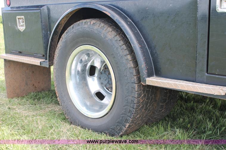 image for item K8914 2014 Dodge Ram 3500HD Quad Cab flatbed pickup truck