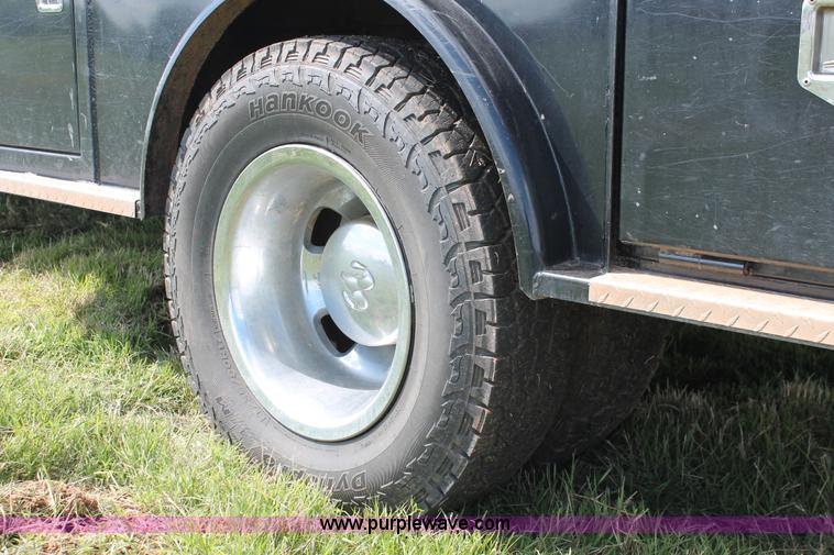 image for item K8914 2014 Dodge Ram 3500HD Quad Cab flatbed pickup truck