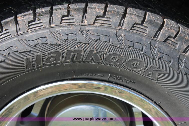 image for item K8914 2014 Dodge Ram 3500HD Quad Cab flatbed pickup truck