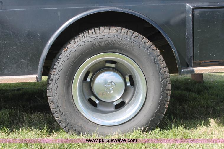 image for item K8914 2014 Dodge Ram 3500HD Quad Cab flatbed pickup truck