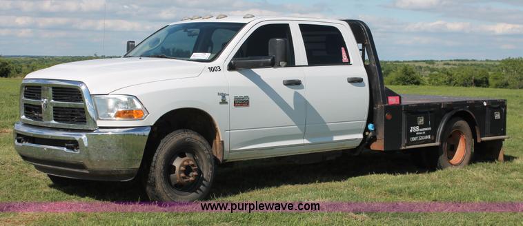 image for item K8915 2011 Dodge Ram 3500HD Quad Cab flatbed pickup truck