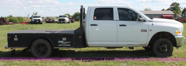 image for item K8915 2011 Dodge Ram 3500HD Quad Cab flatbed pickup truck