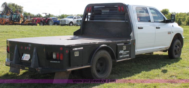 image for item K8915 2011 Dodge Ram 3500HD Quad Cab flatbed pickup truck