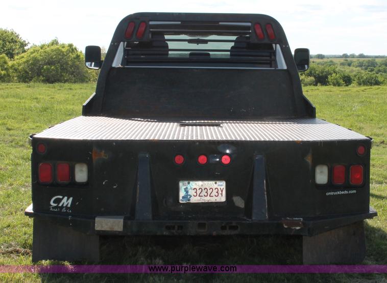 image for item K8915 2011 Dodge Ram 3500HD Quad Cab flatbed pickup truck