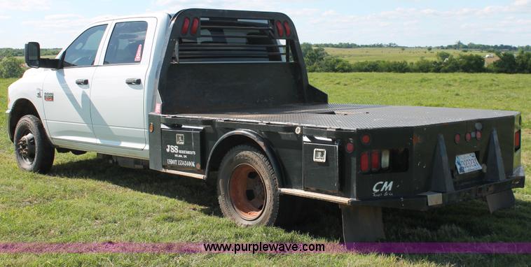 image for item K8915 2011 Dodge Ram 3500HD Quad Cab flatbed pickup truck