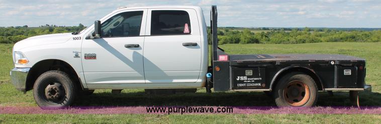 image for item K8915 2011 Dodge Ram 3500HD Quad Cab flatbed pickup truck