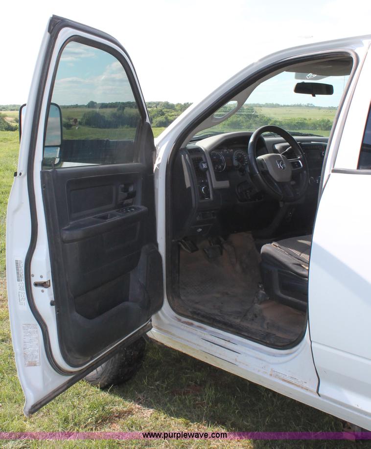 image for item K8915 2011 Dodge Ram 3500HD Quad Cab flatbed pickup truck