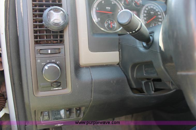 image for item K8915 2011 Dodge Ram 3500HD Quad Cab flatbed pickup truck