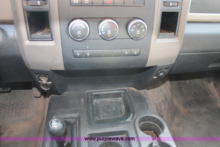 image for item K8915 2011 Dodge Ram 3500HD Quad Cab flatbed pickup truck