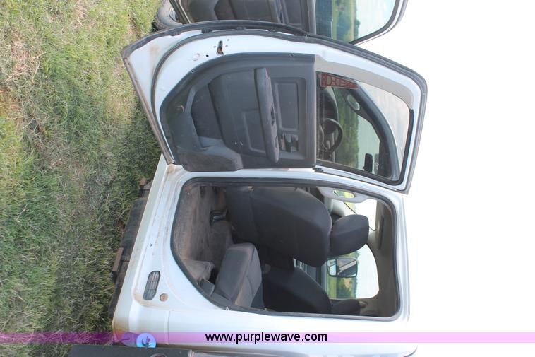 image for item K8915 2011 Dodge Ram 3500HD Quad Cab flatbed pickup truck