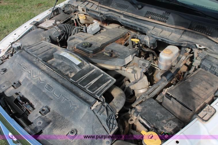 image for item K8915 2011 Dodge Ram 3500HD Quad Cab flatbed pickup truck