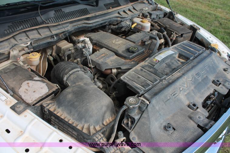 image for item K8915 2011 Dodge Ram 3500HD Quad Cab flatbed pickup truck