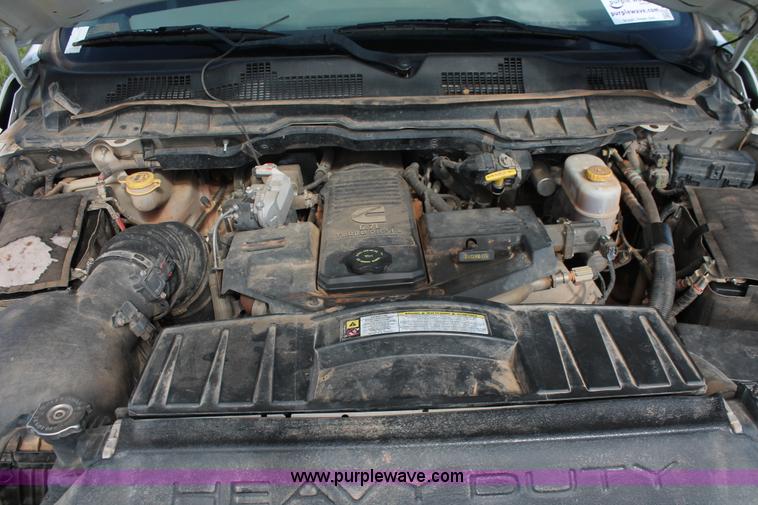 image for item K8915 2011 Dodge Ram 3500HD Quad Cab flatbed pickup truck