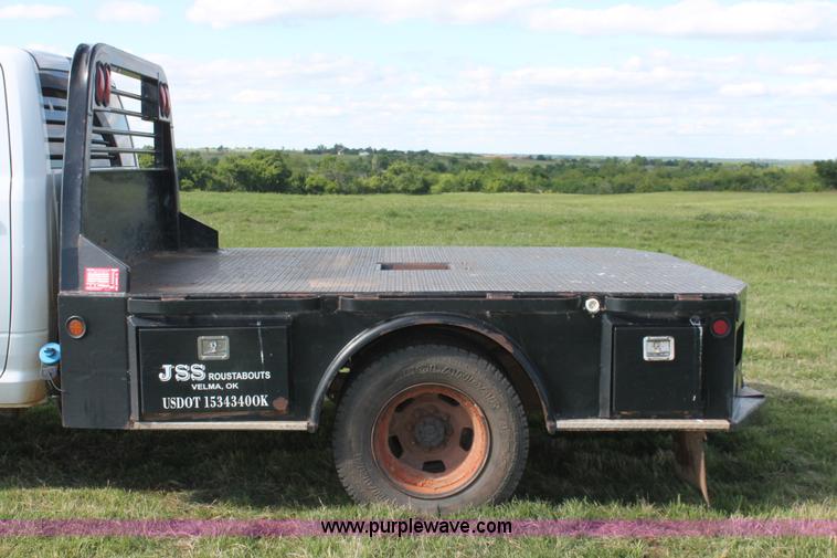 image for item K8915 2011 Dodge Ram 3500HD Quad Cab flatbed pickup truck