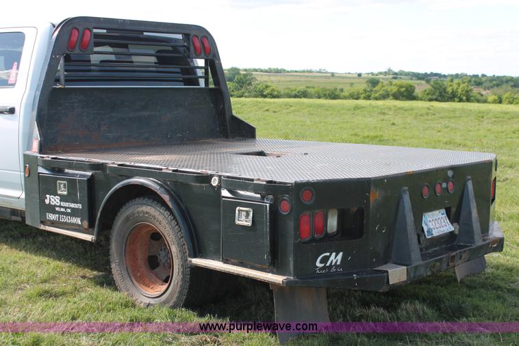 image for item K8915 2011 Dodge Ram 3500HD Quad Cab flatbed pickup truck