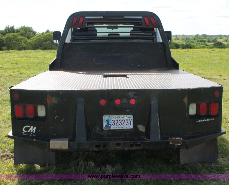 image for item K8915 2011 Dodge Ram 3500HD Quad Cab flatbed pickup truck