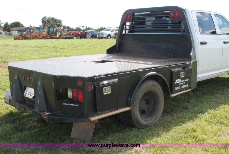 image for item K8915 2011 Dodge Ram 3500HD Quad Cab flatbed pickup truck