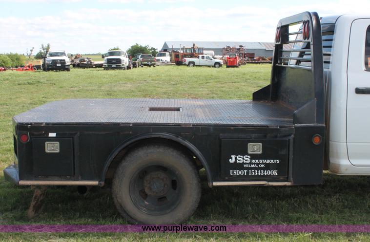 image for item K8915 2011 Dodge Ram 3500HD Quad Cab flatbed pickup truck