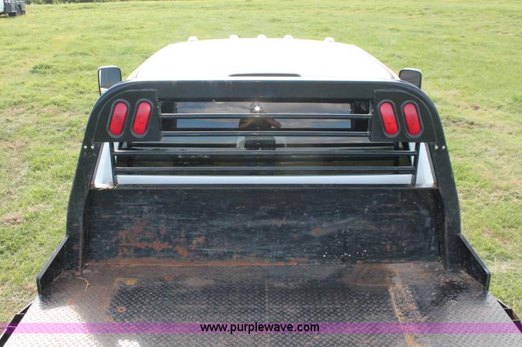 image for item K8915 2011 Dodge Ram 3500HD Quad Cab flatbed pickup truck