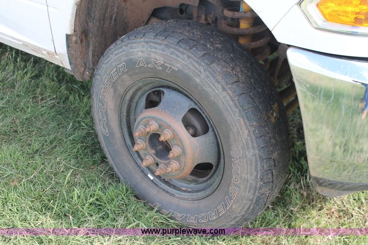 image for item K8915 2011 Dodge Ram 3500HD Quad Cab flatbed pickup truck