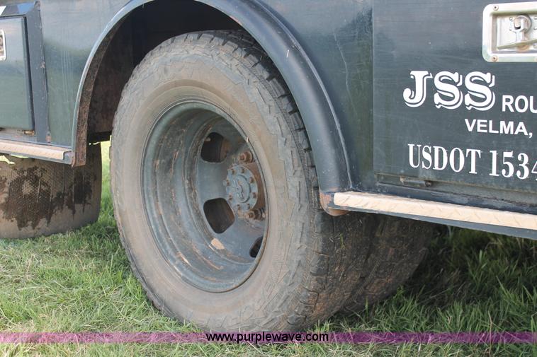 image for item K8915 2011 Dodge Ram 3500HD Quad Cab flatbed pickup truck