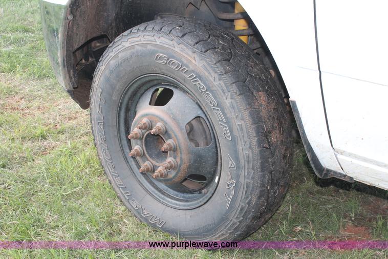 image for item K8915 2011 Dodge Ram 3500HD Quad Cab flatbed pickup truck