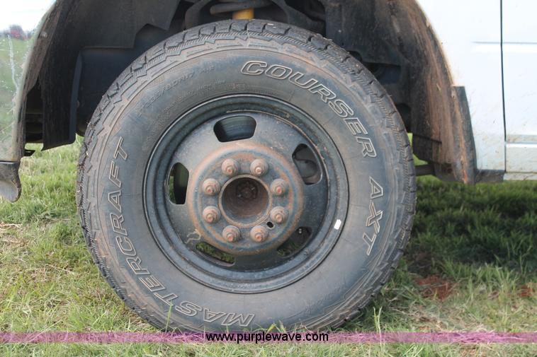 image for item K8915 2011 Dodge Ram 3500HD Quad Cab flatbed pickup truck