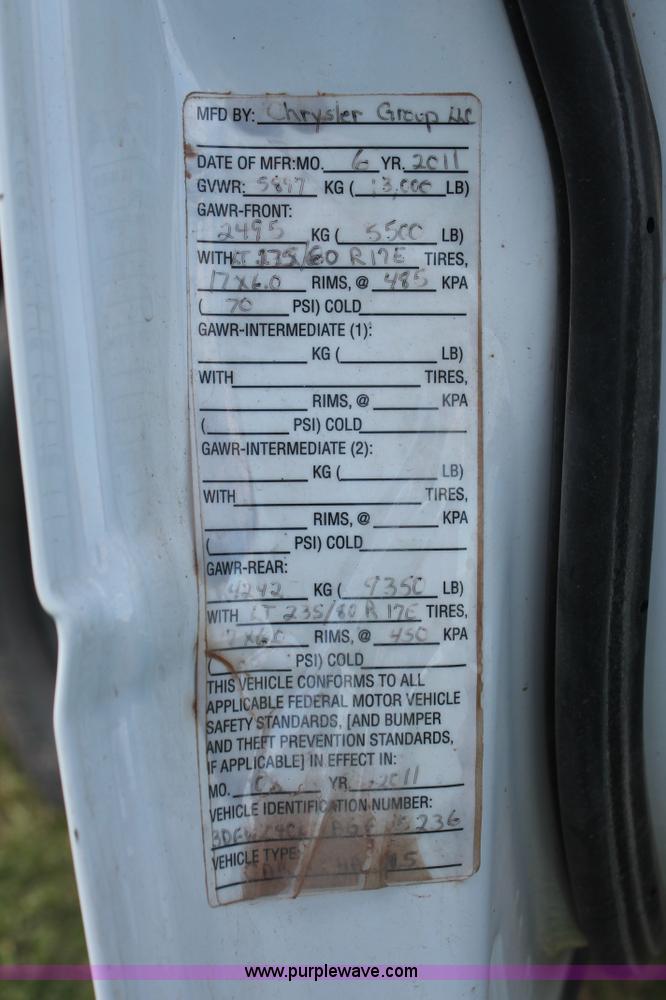 image for item K8915 2011 Dodge Ram 3500HD Quad Cab flatbed pickup truck