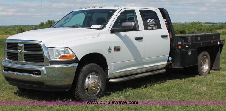 image for item K8916 2011 Dodge Ram 3500HD Quad Cab flatbed pickup truck