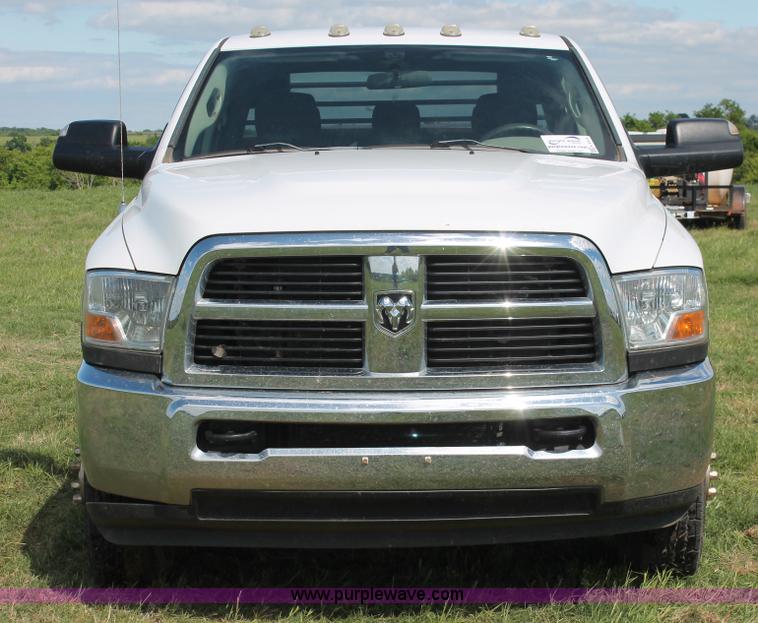 image for item K8916 2011 Dodge Ram 3500HD Quad Cab flatbed pickup truck