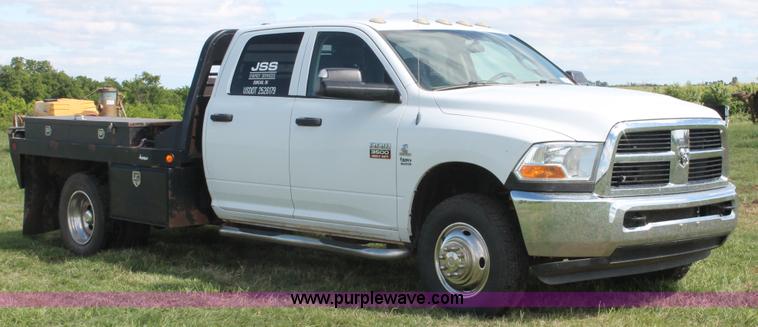 image for item K8916 2011 Dodge Ram 3500HD Quad Cab flatbed pickup truck