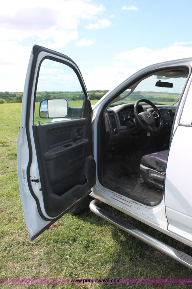 image for item K8916 2011 Dodge Ram 3500HD Quad Cab flatbed pickup truck