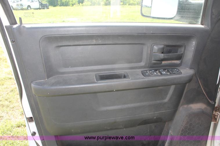 image for item K8916 2011 Dodge Ram 3500HD Quad Cab flatbed pickup truck