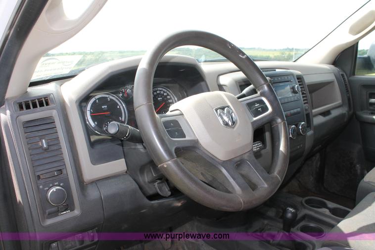 image for item K8916 2011 Dodge Ram 3500HD Quad Cab flatbed pickup truck