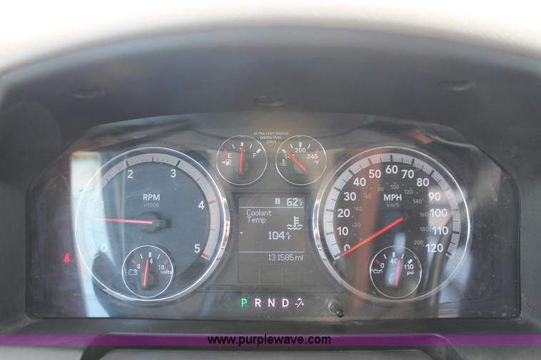 image for item K8916 2011 Dodge Ram 3500HD Quad Cab flatbed pickup truck