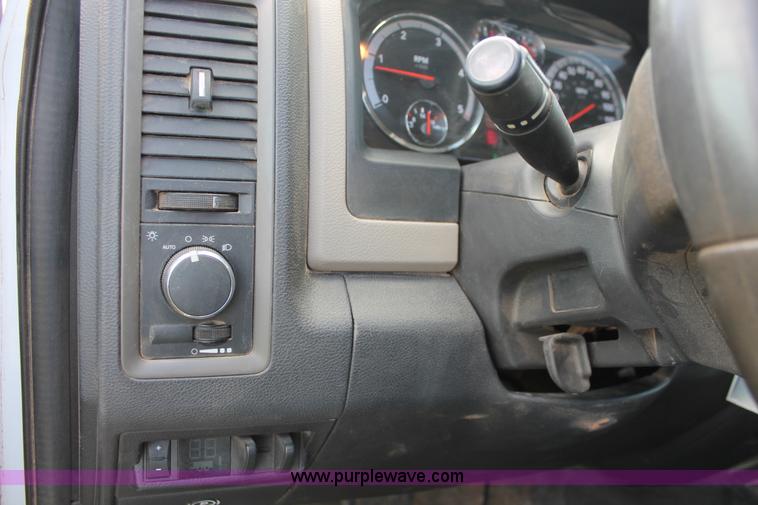 image for item K8916 2011 Dodge Ram 3500HD Quad Cab flatbed pickup truck